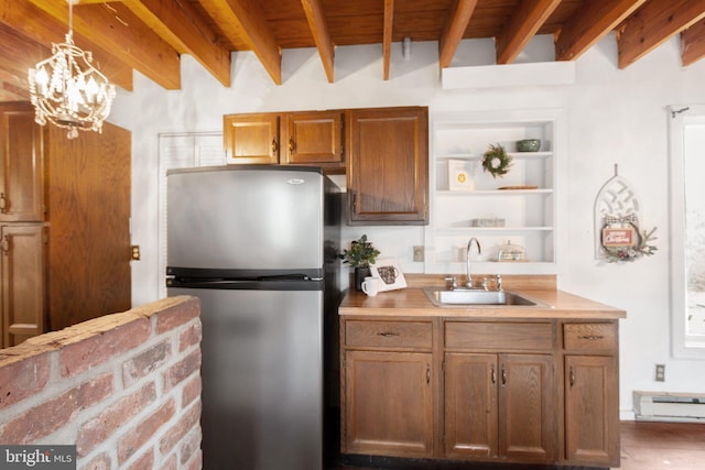 1791 Warrenton Rd, Fredericksburg, VA 22406 - kitchen with freestanding refrigerator, beamed ceiling, light countertops, open shelves, and hanging light fixtures