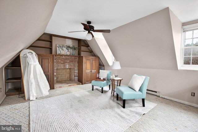 bonus room with vaulted ceiling, a wealth of natural light, a baseboard heating unit, and ceiling fan