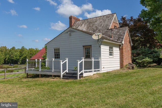 view of yard with a rural view and an outdoor structure