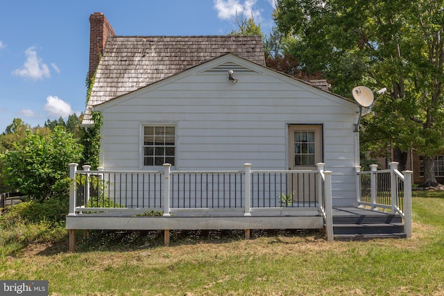1791 Warrenton Rd, Fredericksburg, VA 22406 - back of house featuring a chimney, a deck, and a yard