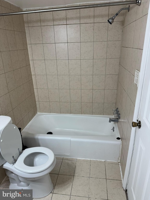 full bathroom with  shower combination, tile patterned flooring, and toilet