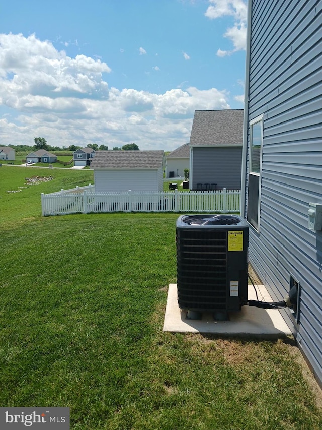 view of yard with central AC unit