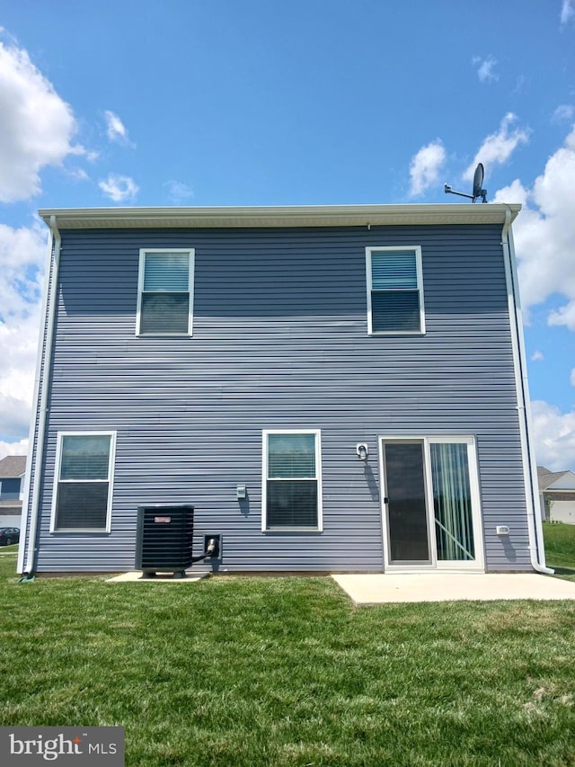 back of house with a patio, cooling unit, and a lawn