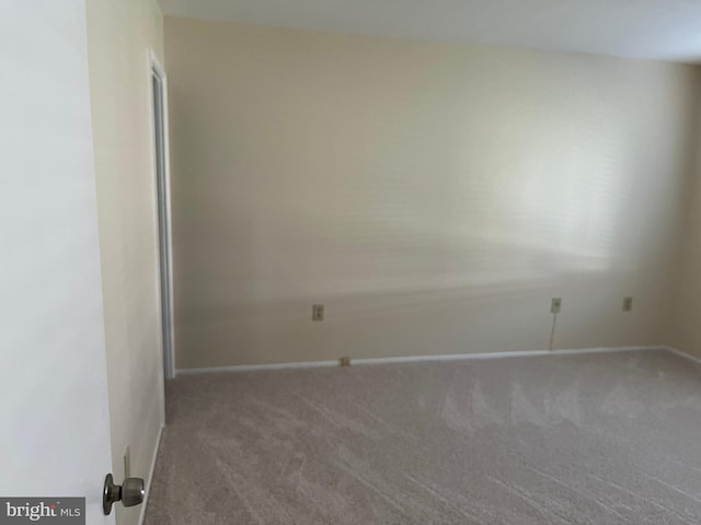 unfurnished room with carpet floors