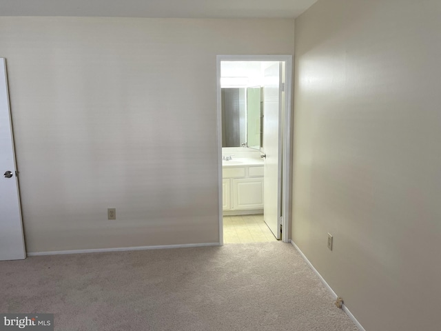 interior space with light colored carpet and sink