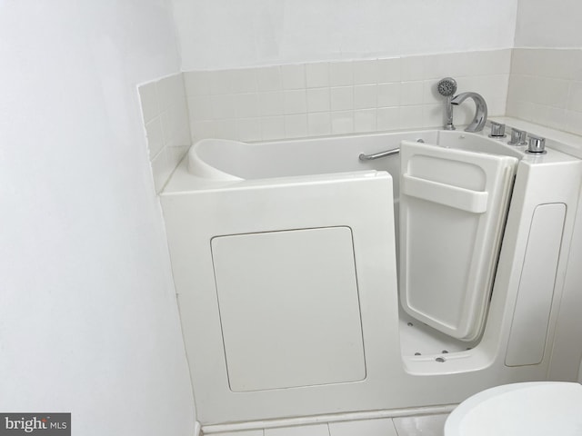 bathroom featuring tile patterned flooring and toilet