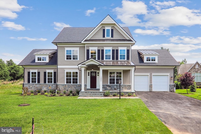 craftsman-style home with a garage and a front lawn