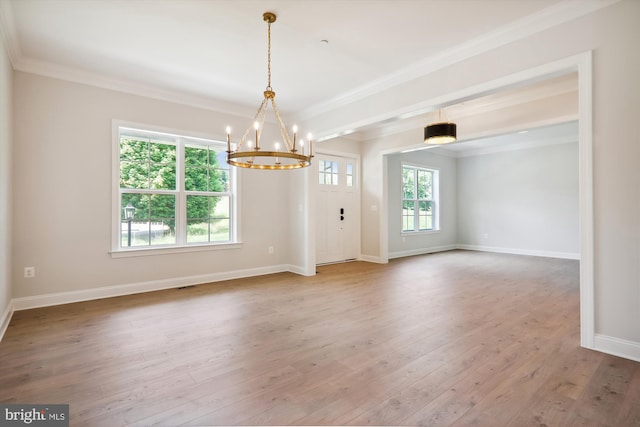 interior space with ornamental molding, hardwood / wood-style floors, and plenty of natural light