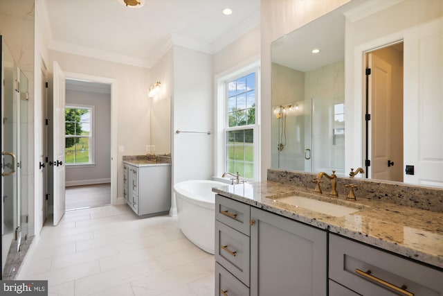 bathroom featuring vanity, ornamental molding, and separate shower and tub