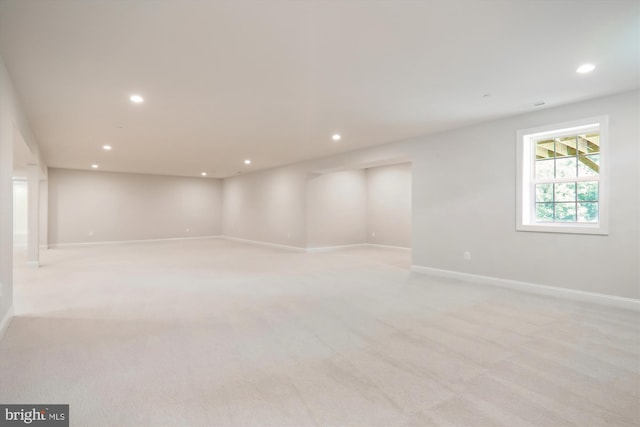 unfurnished room with light carpet