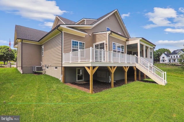 back of property featuring central AC, a wooden deck, and a lawn