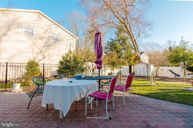 view of patio featuring a shed