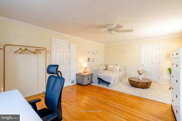 bedroom with ceiling fan, wood-type flooring, and crown molding