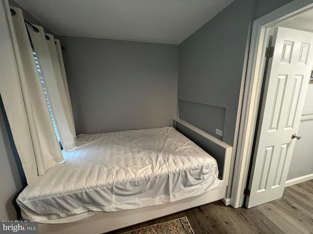 bedroom with wood-type flooring