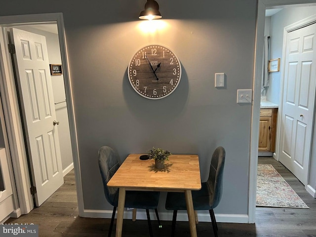 dining area featuring dark hardwood / wood-style flooring