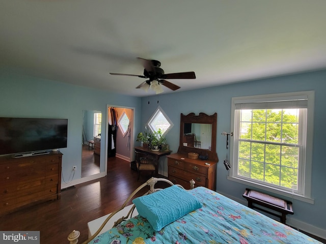 bedroom with dark wood-type flooring and ceiling fan