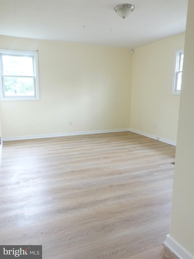 spare room with light wood-type flooring