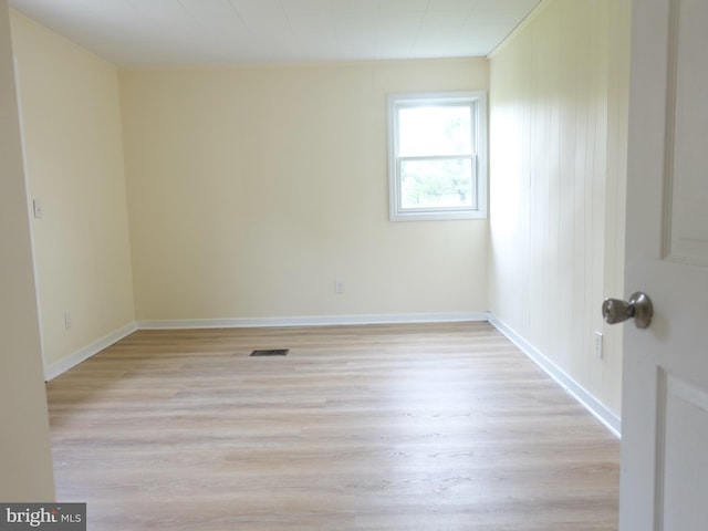 empty room with light hardwood / wood-style floors