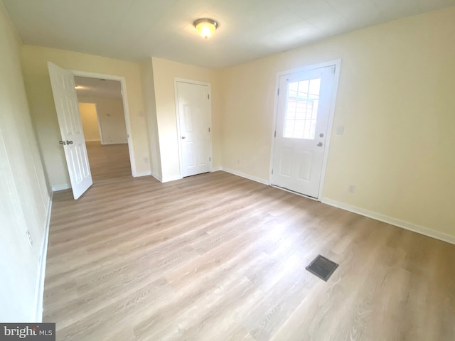 spare room with light hardwood / wood-style floors