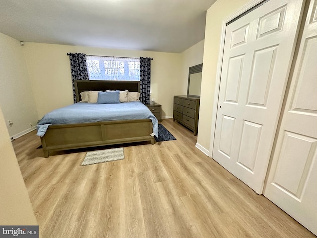 bedroom featuring a closet and light hardwood / wood-style flooring