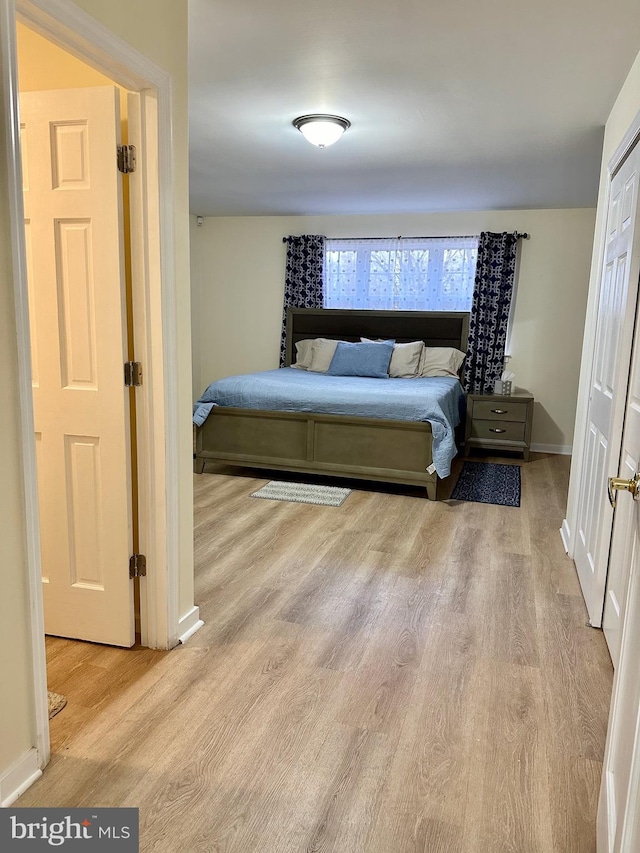 bedroom with light wood-type flooring