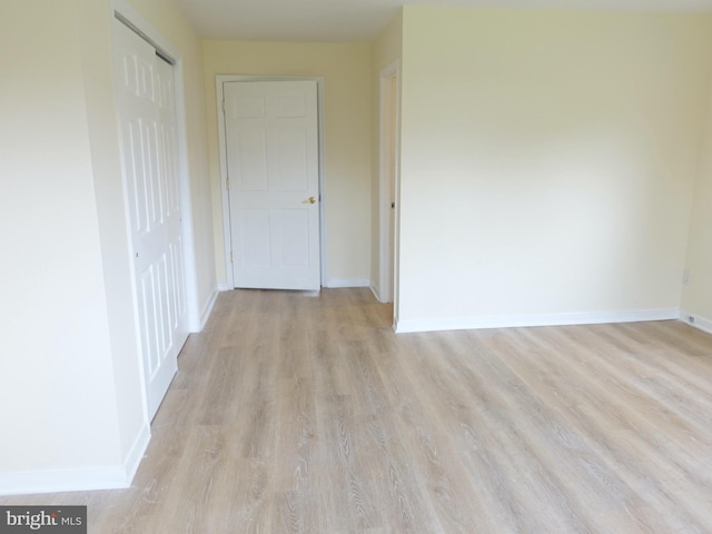 unfurnished room featuring light hardwood / wood-style flooring