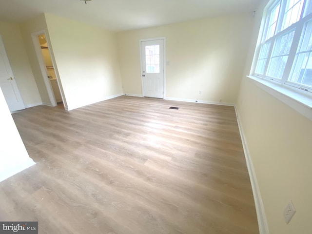 unfurnished room with light hardwood / wood-style flooring