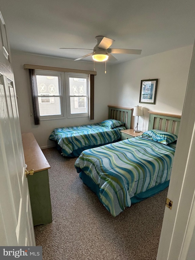 bedroom with ceiling fan and carpet floors