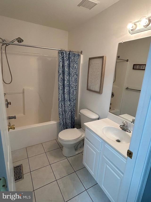 full bathroom with shower / bath combo with shower curtain, tile patterned flooring, vanity, and toilet