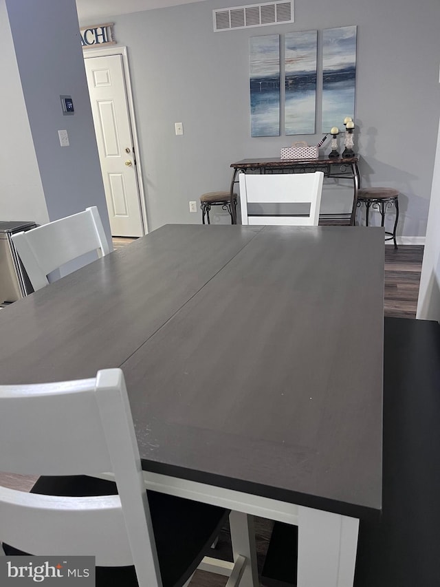 dining area with hardwood / wood-style floors