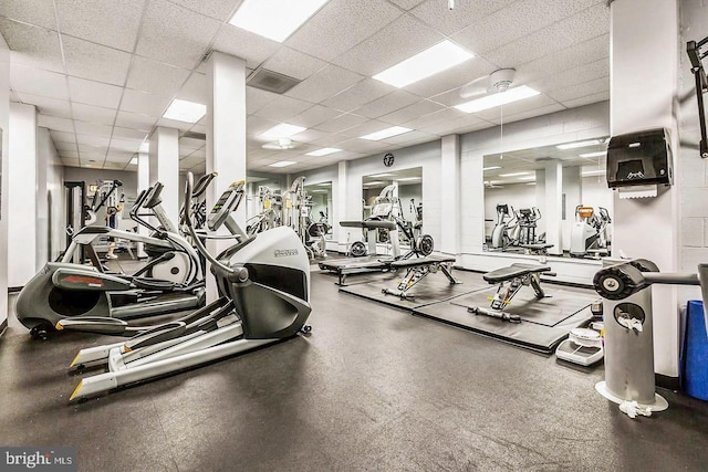 workout area with a paneled ceiling