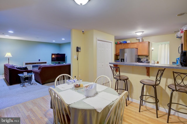 dining area with light wood-type flooring