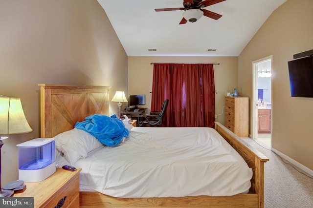 carpeted bedroom with lofted ceiling, connected bathroom, and ceiling fan