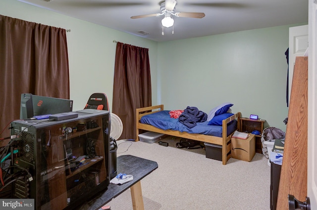 carpeted bedroom featuring ceiling fan