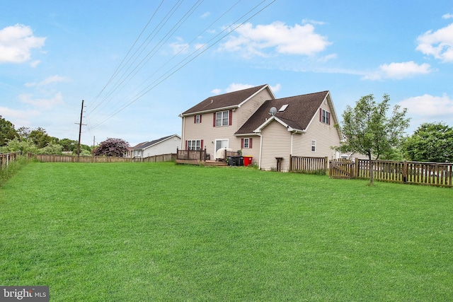 rear view of house with a lawn