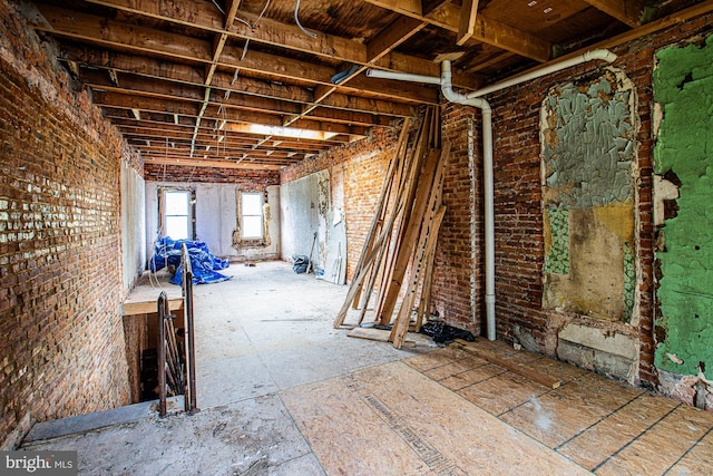 miscellaneous room with brick wall