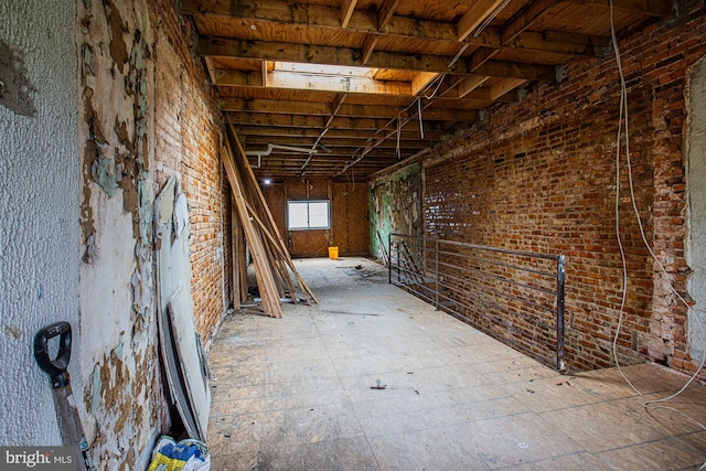 miscellaneous room with brick wall