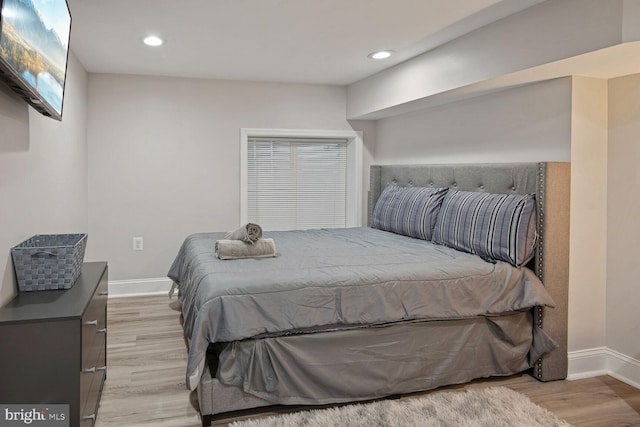 bedroom with light hardwood / wood-style flooring