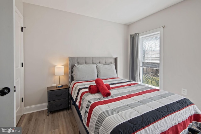 bedroom with wood-type flooring