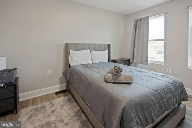 bedroom featuring hardwood / wood-style flooring