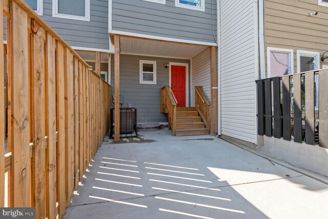 entrance to property with central AC unit