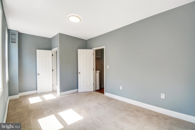 unfurnished bedroom featuring carpet