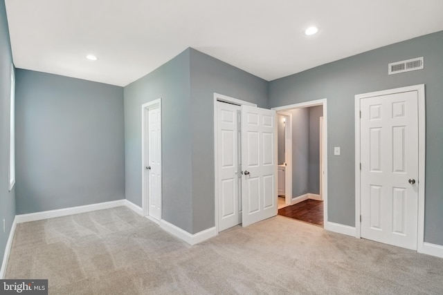 unfurnished bedroom with carpet floors