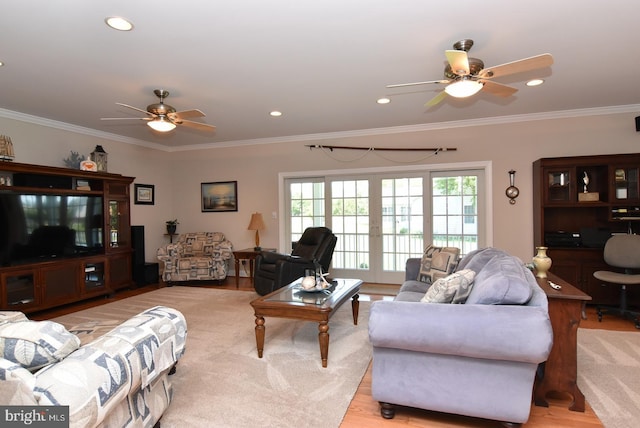 living room featuring crown molding, french doors, and light hardwood / wood-style floors