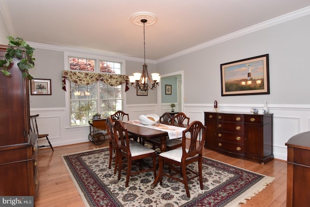 bathroom featuring tiled tub, crown molding, tile patterned flooring, and vanity