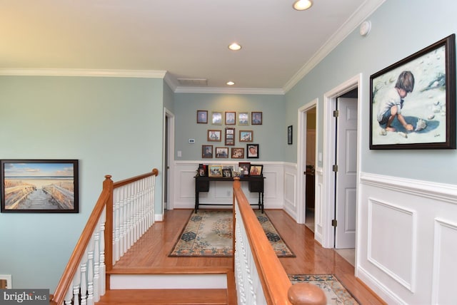 living room with ceiling fan, light wood-type flooring, and ornamental molding