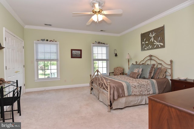 bedroom featuring multiple windows, ceiling fan, crown molding, and light carpet