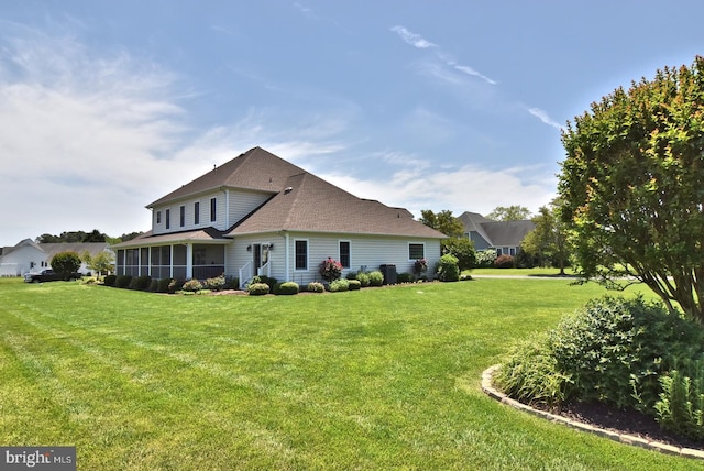 view of front property with solar panels, a garage, and a front lawn