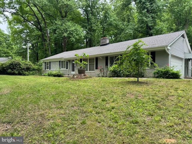 ranch-style house with an attached garage, a chimney, and a front lawn