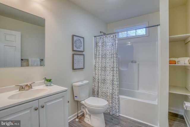 full bathroom featuring shower / bath combination with curtain, vanity, toilet, and hardwood / wood-style floors